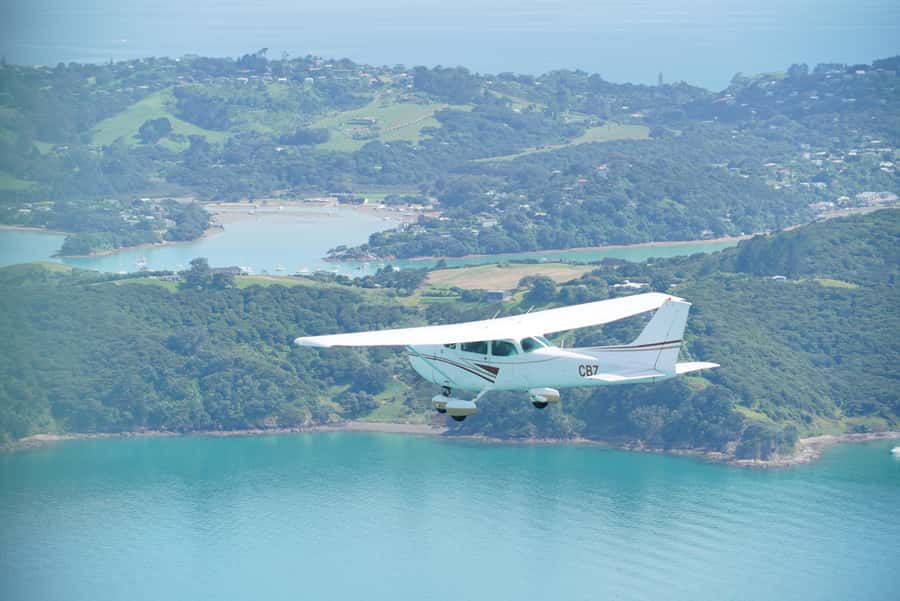 Auckland: Auckland City & Hauraki Gulf Scenic Flight - Crossing Toward Auckland: Motuhie, Browns Islands, and the City Reveal