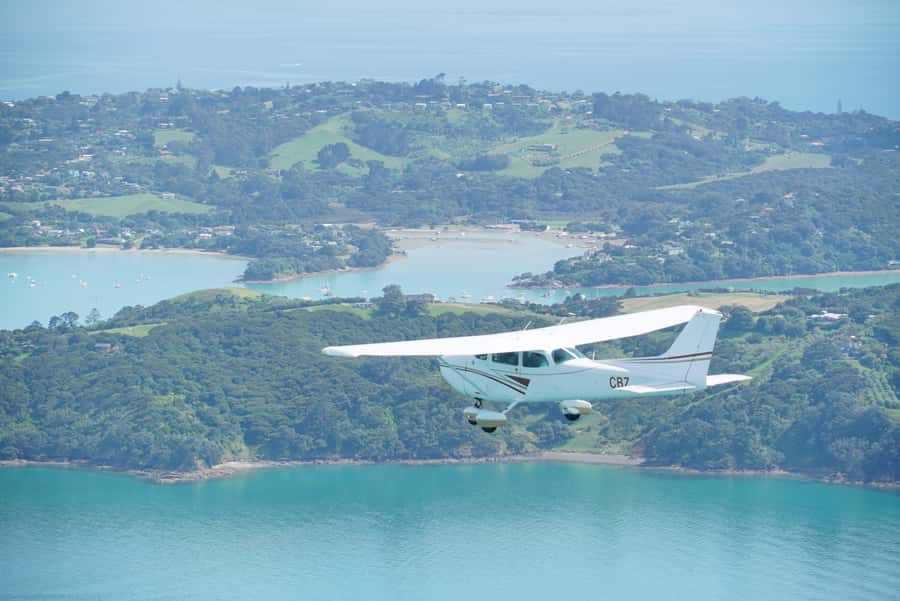 Auckland: Waiheke Island Wine and Food Tasting with Flights - Getting There: Pickup, Van Ride, and the Flight Switch