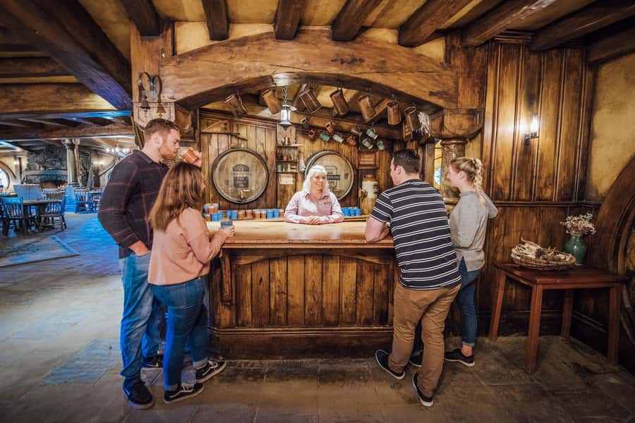 From Matamata: Guided Hobbiton Experience with Bus Transfers - Weather-proof fun in Waikato: umbrellas, short drive, and realistic expectations